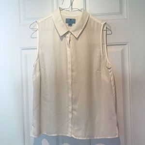 White sleeveless button down blouse